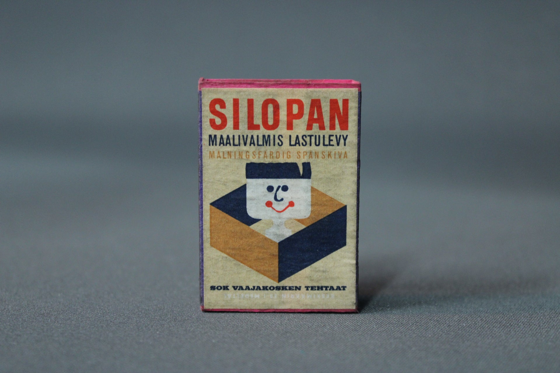 Silopan-lastulevyn mainos tulitikkurasiassa, vintage-kuvitus