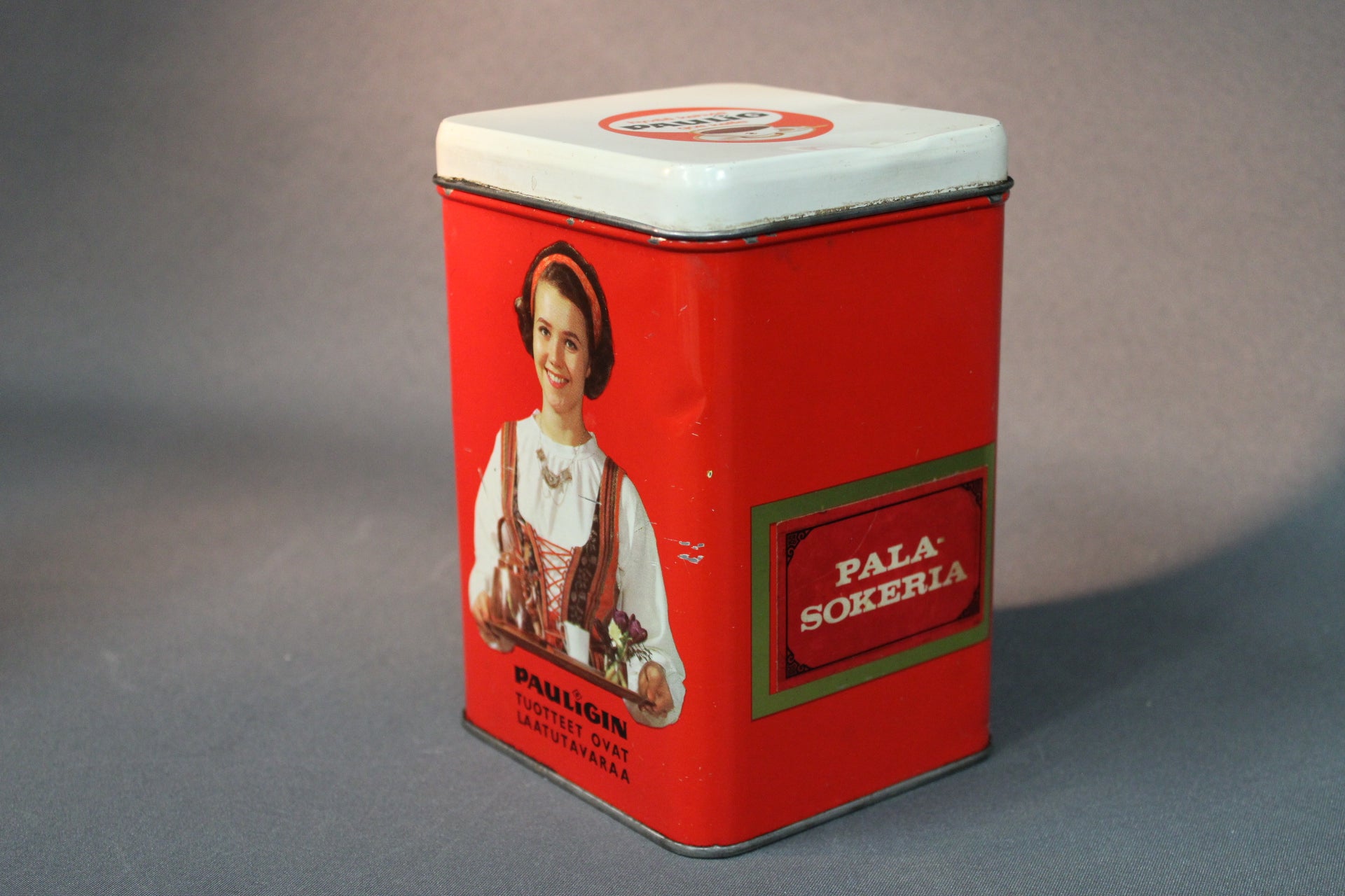 Pauligin retro peltipurkki, pala-sokeria-teksti ja sivukuva